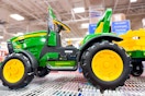 john deere tractor ride-on on a shelf