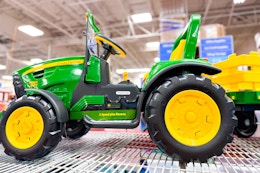 john deere tractor ride-on on a shelf