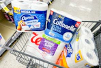 charmin, cottonelle, scott, and walgreens brand toilet paper in a cart