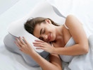 a woman on a neck pillow