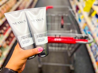 hand holding two Nexxus stylers