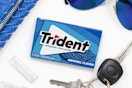 a pack of gum next to keys