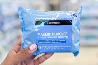 Hand holding a pack of Neutrogena Makeup Remover aisle in aisle