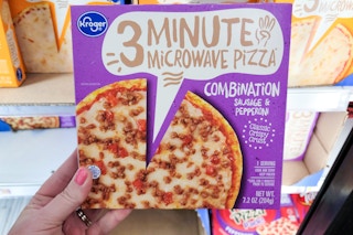 hand holding kroger 3-minute microwave pizza at kroger