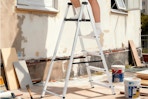 a man using a step ladder