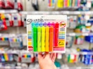 hand holding a pack of sharpie highlighters at target