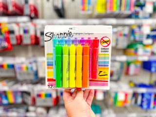hand holding a pack of sharpie highlighters at target