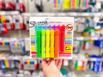 hand holding a pack of sharpie highlighters at target