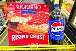 digiorno pizza and a pepsi 2-liter in a yellow shopping cart