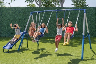 lifestyle image of children playing on a swing set