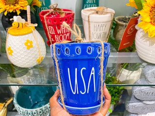 Rae Dunn planters on shelf