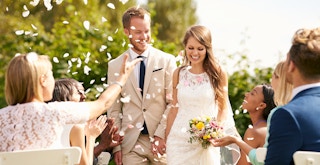 husband and wife recessional after wedding ceremony feature