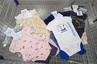 4 carters baby outfit sets in a shopping cart