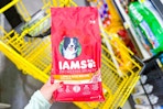hand holding a bag of iams proactive health dog food