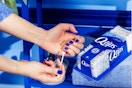 Q-tips Cotton Swabs being used to remove nail polish