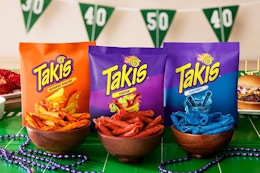 Takis bags and chips on a game day themed table