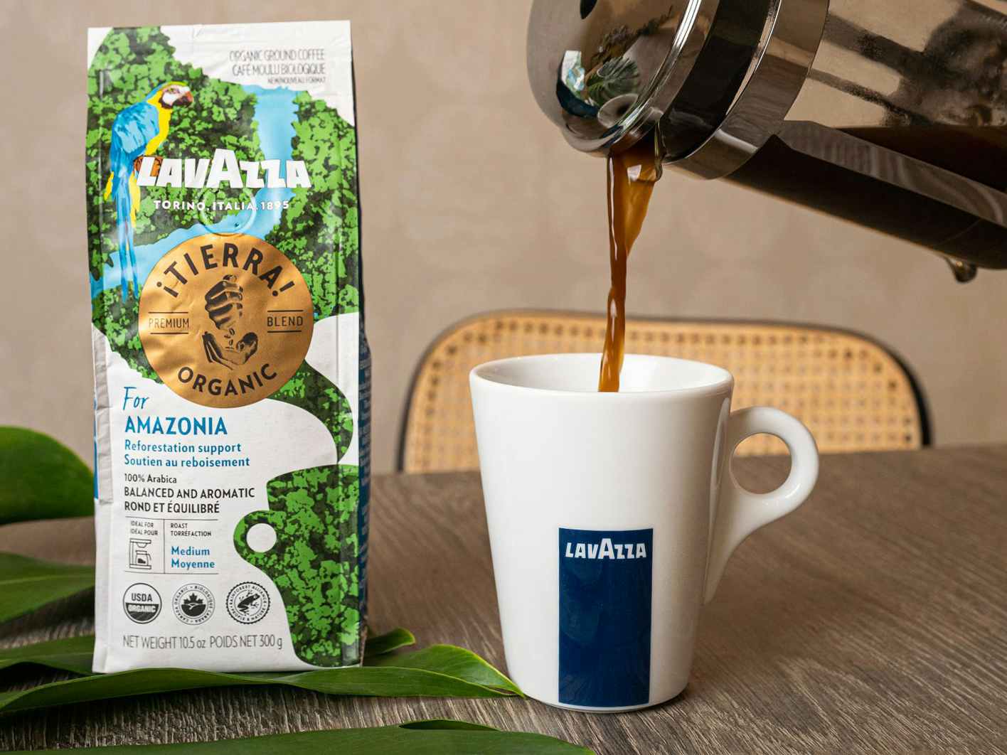 french press pouring lavazza organic for amazonia coffee into mug