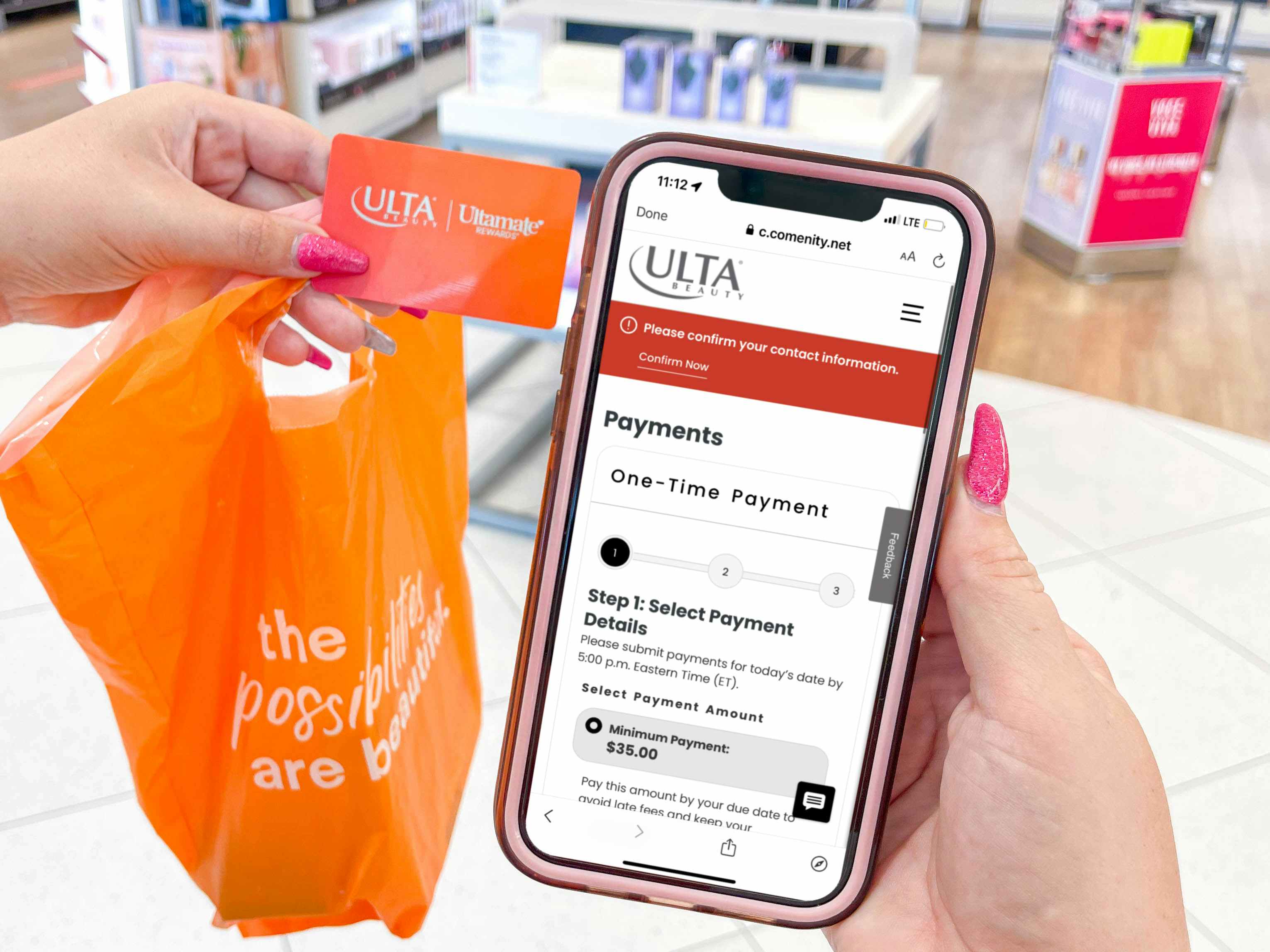 a woman holding a ulta bag and ulta credit card and a cellphone with app to make a payment