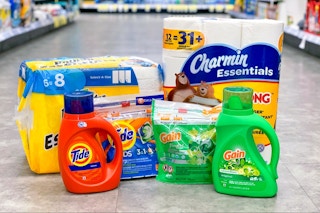 bounty paper towels, charmin toilet paper, gain detergent, and tide detergent arranged on the floor