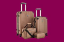 Stock photo of a brown Travelers Cluc 4-piece luggage set