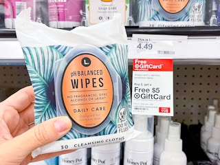 hand holding feminine wipes