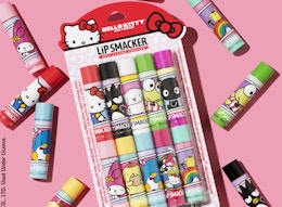 a Hello Kitty lip balm set on a pink background