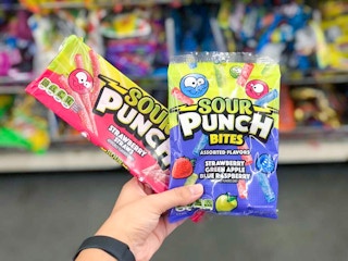 hand holding sour punch candy at dollar tree