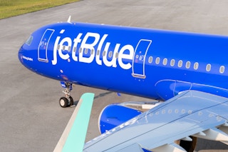 a jet blue plane on runway