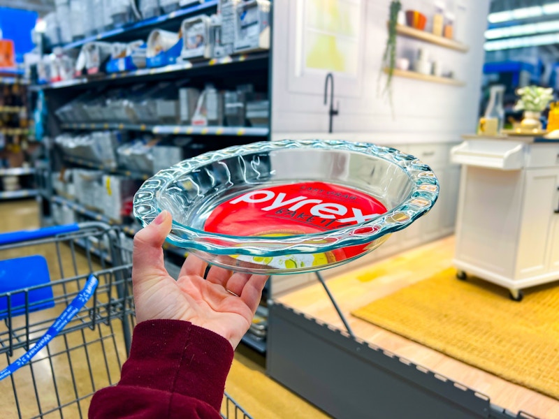 hand holding pyrex easy grab pie plate near walmart cart