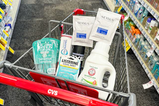 venus razors, sensodyne toothpaste, listerine breath strips, nexxus hair masks, axe deodorant, and arm & hammer detergent in a cart