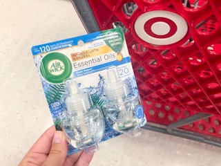 hand holding air wick scented oil refills at target