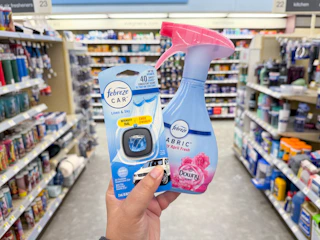 hand holding febreze products in walgreens