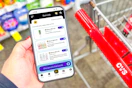 hand holding a smartphone displaying kcl coupons
