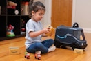 a child playing with radio flyer amazon van