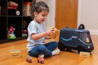 a child playing with radio flyer amazon van