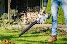 leaf blower being used in yard