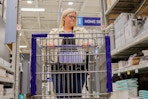 a person pushing a cart in lowes