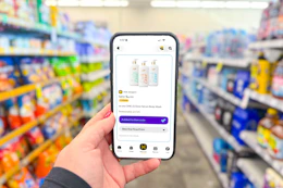 hand holding a smartphone displaying kcl coupons