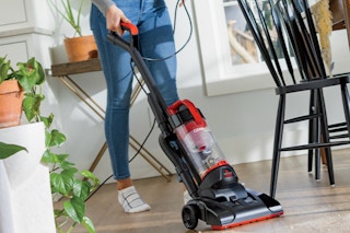 Person using Bissel Vacuum