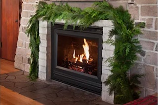 lifestyle image of garland over a fireplace