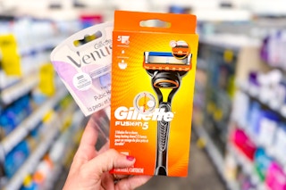 hand holding gillette and venus razors