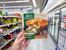 hand holding marie callender's frozen meal at walgreens