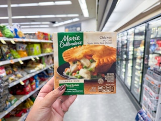hand holding marie callender's frozen meal at walgreens