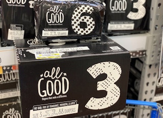 all good diapers in large black box and small black plastic bag balanced on walmart cart
