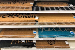 shelf of Target doormats