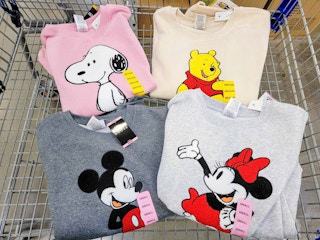 Some Disney shirts in a cart at Sam's Club