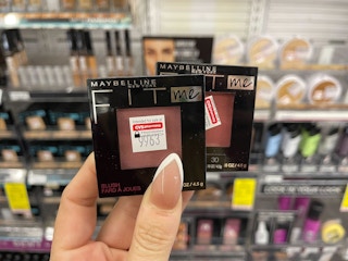 hand holding two Maybelline Fit Me blushes