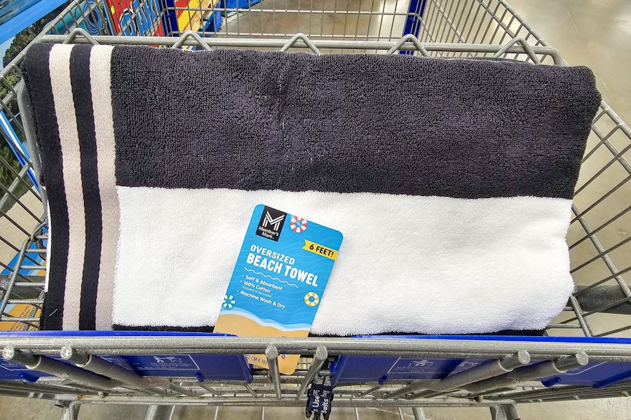 black and white beach towel in a cart