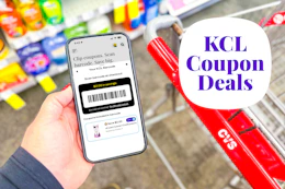 hand holding a smartphone displaying a KCL Coupon barcode
