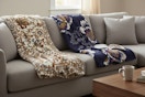 two vera bradley throw blankets on a couch